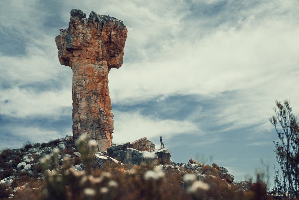 Sentinel of the Cederberg: A lone figure stands in quiet contemplation, humbled by the ancient, towering majesty.