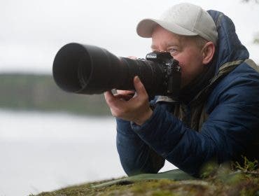 photographer posing with his equipment