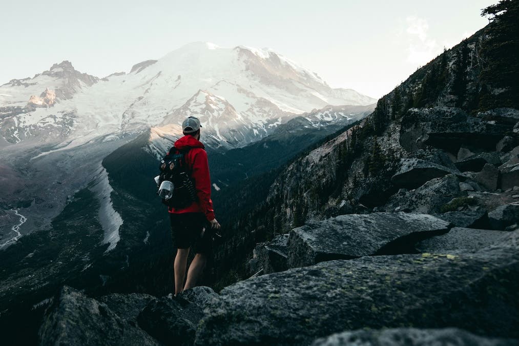 man looking at mountain view