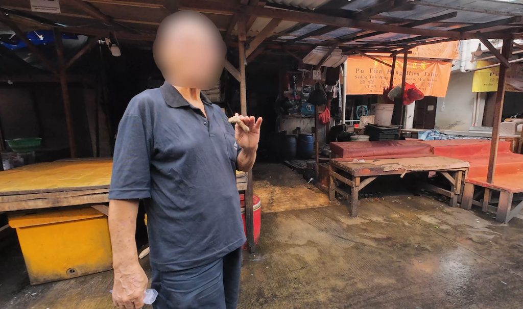 old man with blurred out face