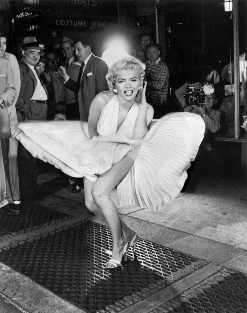 NEW YORK - SEPTEMBER 1954: Marilyn Monroe with the skirt of her white dress blowing as she stands over a subway grate at the corner of 51st Street and Lexington Avenue in September, 1954 during the filming of 'The Seven Year Itch' in New York, New York. (Photo by Sam Shaw/Shaw Family Archives/Getty Images) *** Local Caption *** Marilyn Monroe