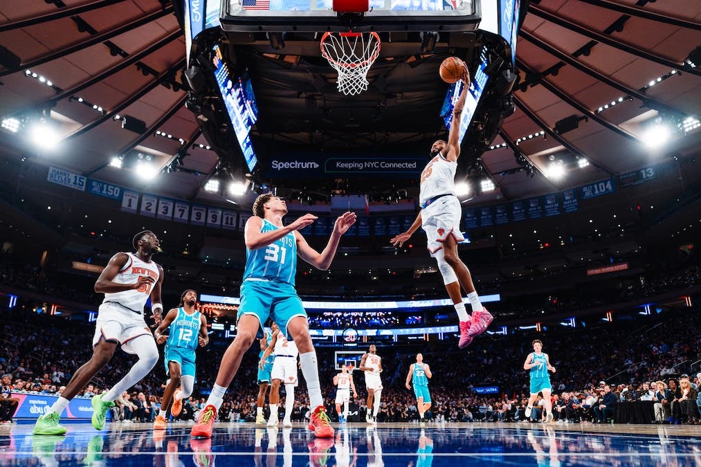 Mikal Bridges of the New York Knicks goes for a fast-break layup against the Charlotte Hornets
