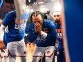 An emotional Jalen Brunson is surrounded by New York Knicks teammates during the playoffs against the Cleveland Cavaliers