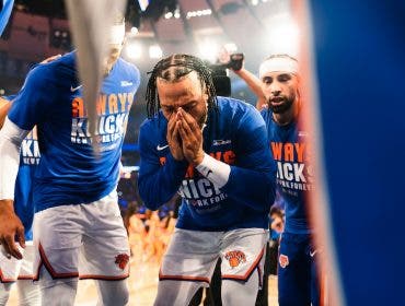 An emotional Jalen Brunson is surrounded by New York Knicks teammates during the playoffs against the Cleveland Cavaliers