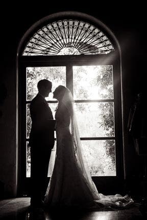 Silhouette wedding kiss